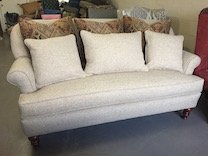 tight back sofa with throw pillows